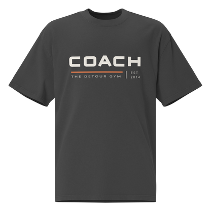 Coach Boxy Tee in Faded Black, AS Colour 5082, front view. Genuine Printful garment mockup.