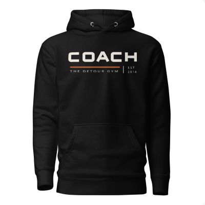 Coach Pullover Hoodie in Black, Cotton Heritage M2580, with bold COACH chest lettering. Genuine supplier mockup.