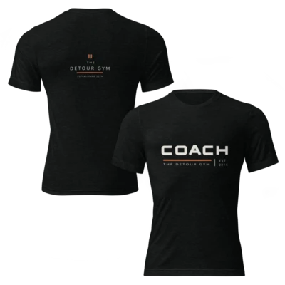 Coach Soft Tee in Solid Black Triblend, showing bold chest lettering and coordinating back graphic. Genuine Printful front and back mockup.