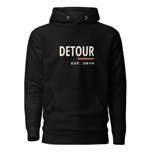 Cutline Pullover Hoodie in Black, Cotton Heritage M2580, with Detour chest graphic. Genuine Printful garment mockup.